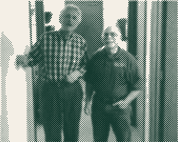 Two OPCC volunteers in the clinic hallway.